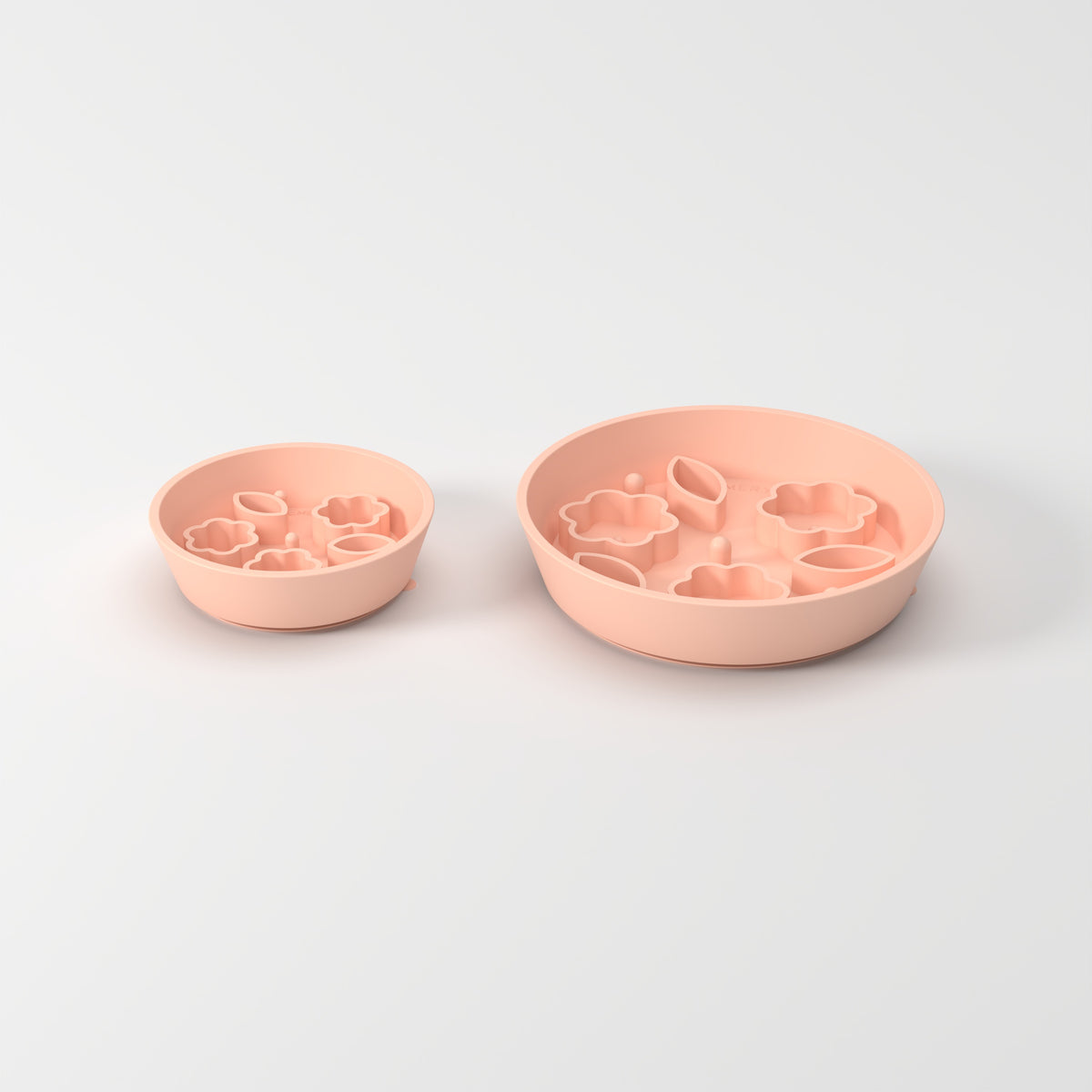 Small and Medium Peach Flower + Leaf slow feeder bowls, size comparison three-quarter studio view