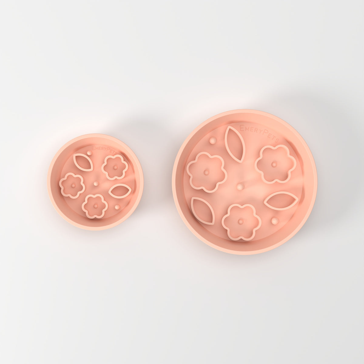 Small and Medium Peach Flower + Leaf slow feeder bowls, size comparison top-down studio view
