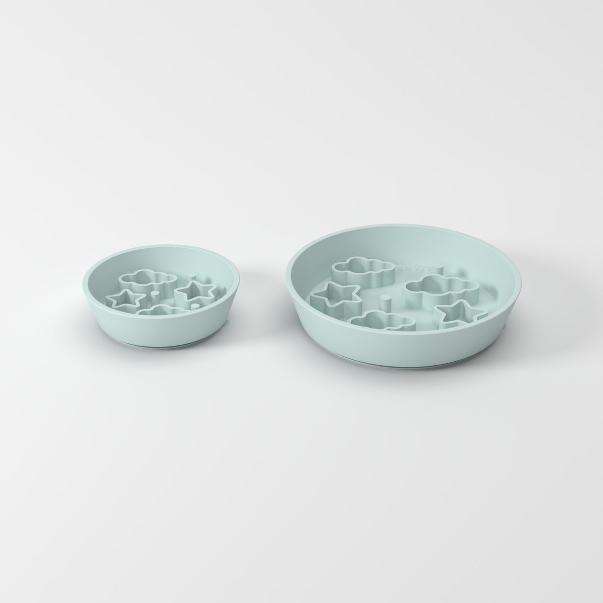 Small and Medium Blue Star + Cloud slow feeder bowls, size comparison three-quarter studio view