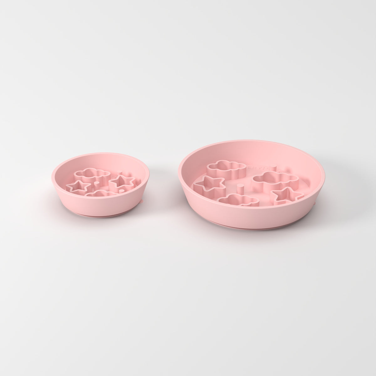 Small and Medium Pink Star + Cloud slow feeder bowls, size comparison three-quarter studio view