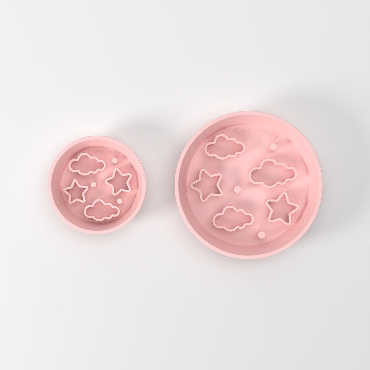 Small and Medium Pink Star + Cloud slow feeder bowls, size comparison top-down studio view