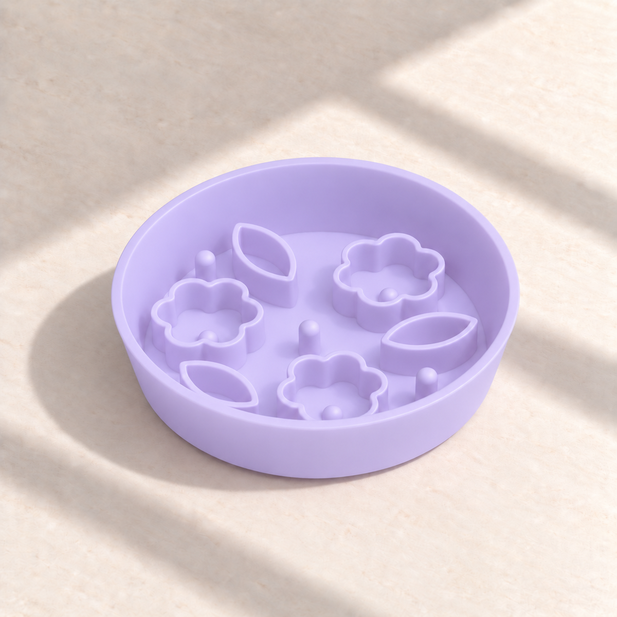 Jelly Purple Flower + Leaf slow feeder bowl, 8-inch diameter, empty on a sunlit cream table