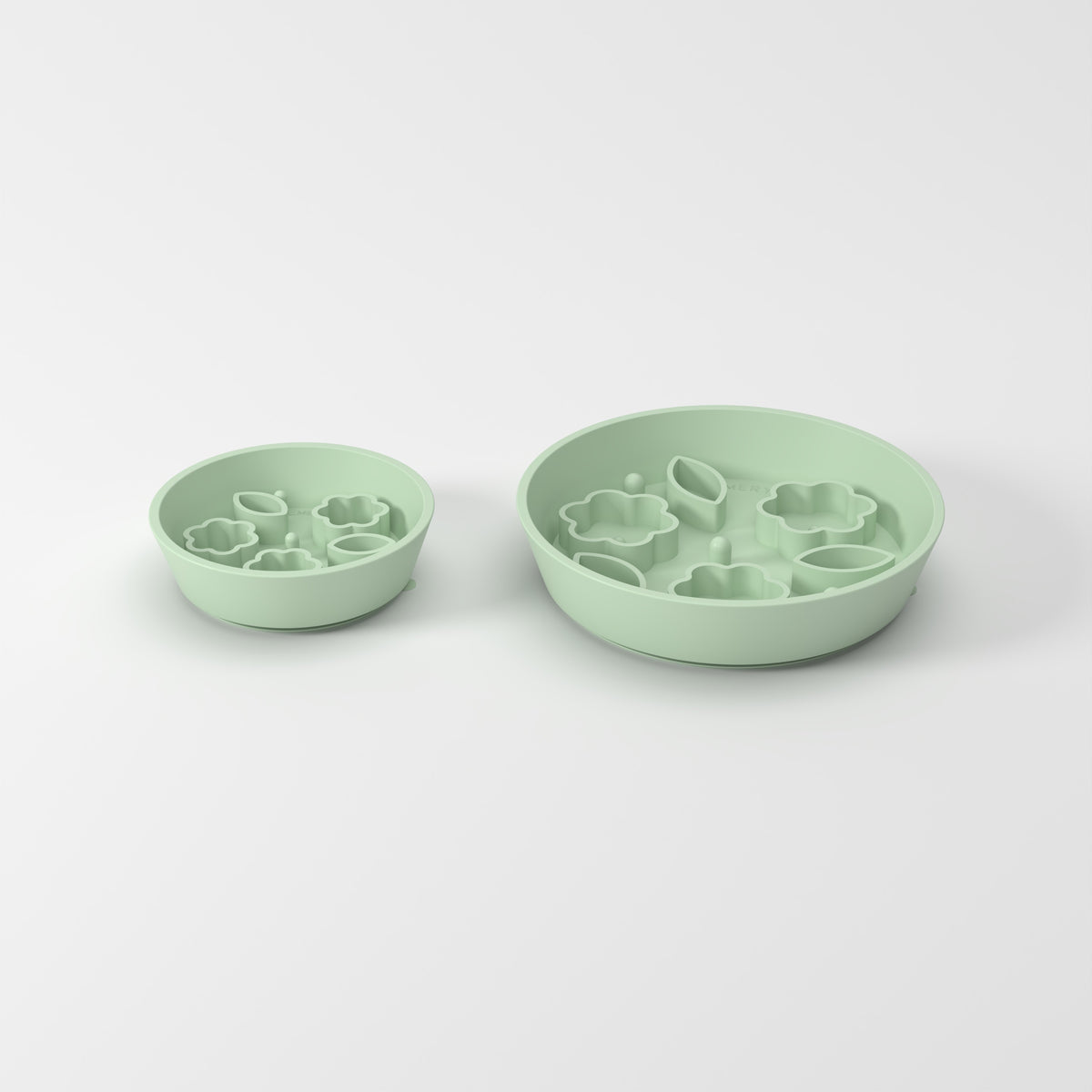 Small and Medium Green Flower + Leaf slow feeder bowls, size comparison three-quarter studio view