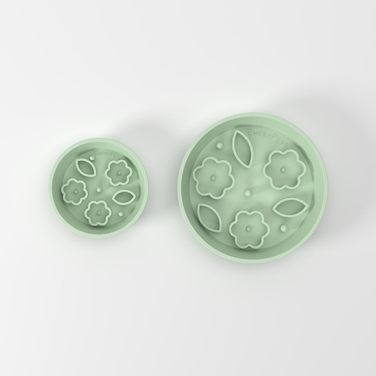 Small and Medium Green Flower + Leaf slow feeder bowls, size comparison top-down studio view