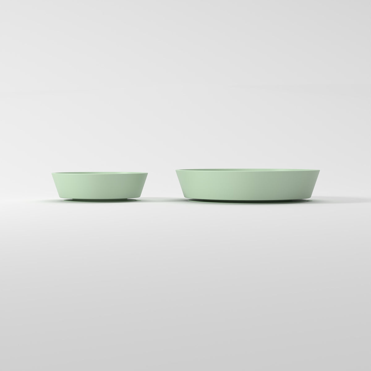 Small and Medium Green Flower + Leaf slow feeder bowls, size comparison side studio view