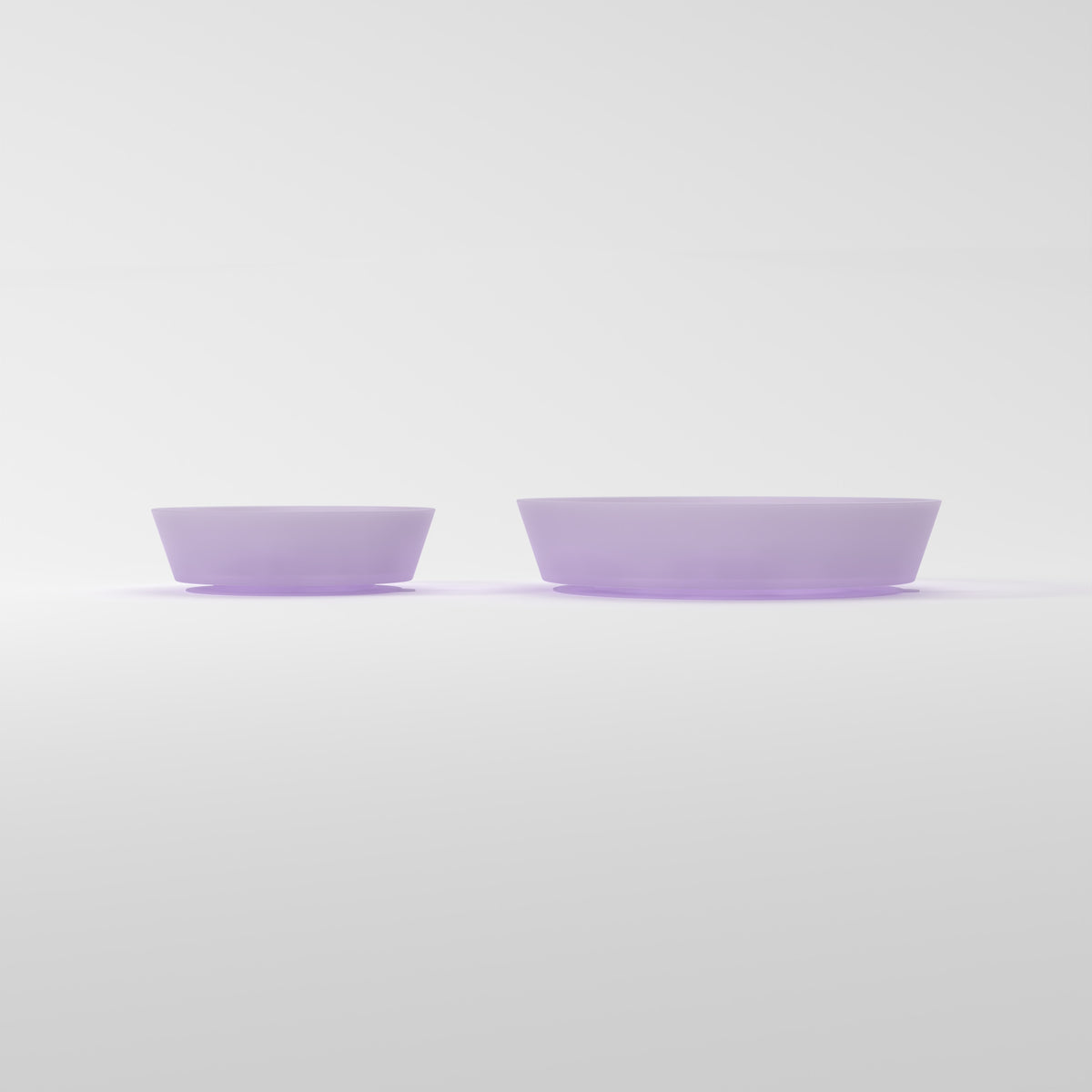 Small and Medium Jelly Purple Flower + Leaf slow feeder bowls, size comparison side studio view