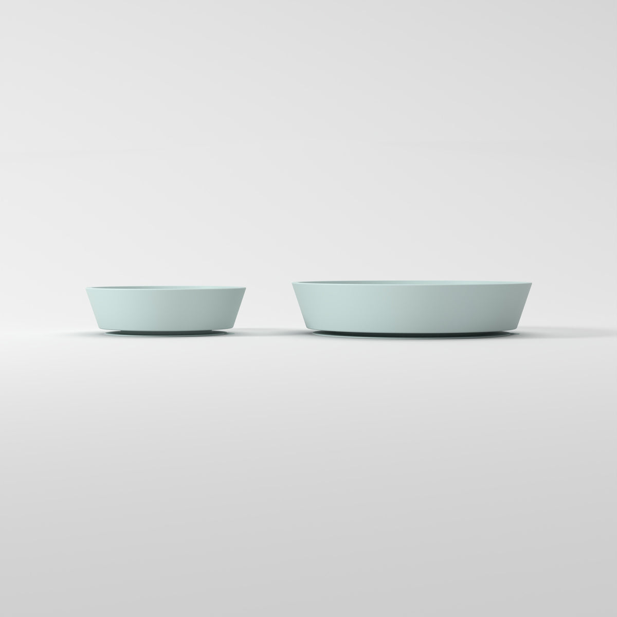 Small and Medium Blue Star + Cloud slow feeder bowls, size comparison side studio view