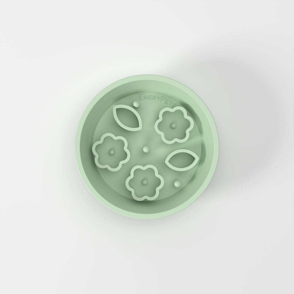 Small Green Flower + Leaf slow feeder bowl, empty top-down studio view