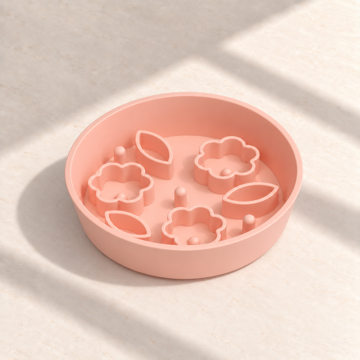 Peach Flower + Leaf slow feeder bowl, 8-inch diameter, empty on a sunlit cream table