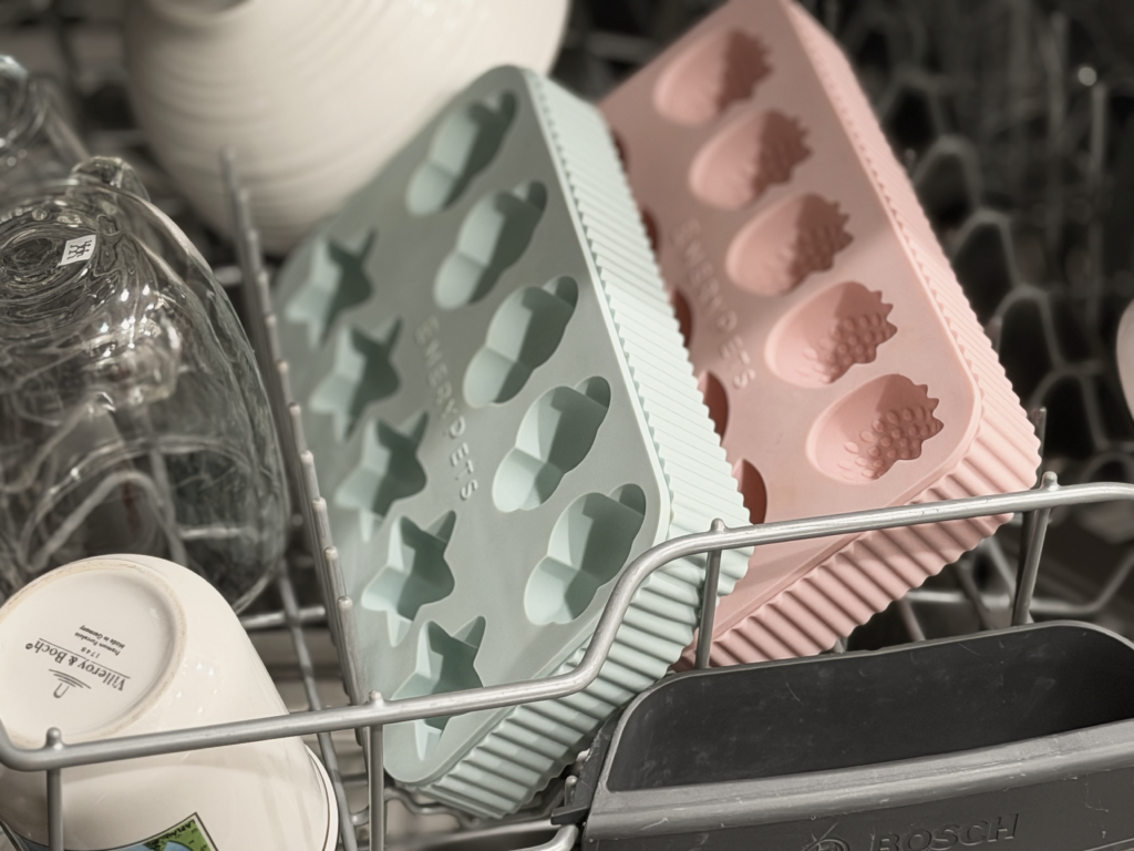 Example silicone treat molds arranged in a dishwasher rack.